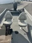 Slide: The Image of 2024 Smoker Craft Freedom 180 SC boat interior with two seats and motor. - 5