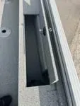 Slide: The Image of 2024 Smoker Craft Freedom 180 SC boat storage compartment, open lid, gray interior. - 8