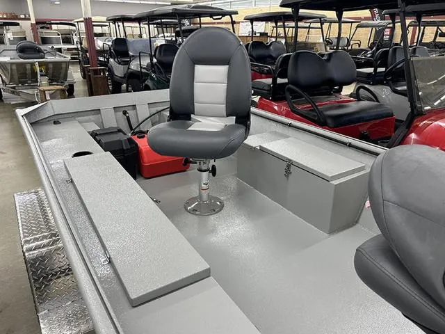 Slide: The Image of 2025 XTREME BOATS River Skiff 1542SS interior with seating and storage compartments. - 3