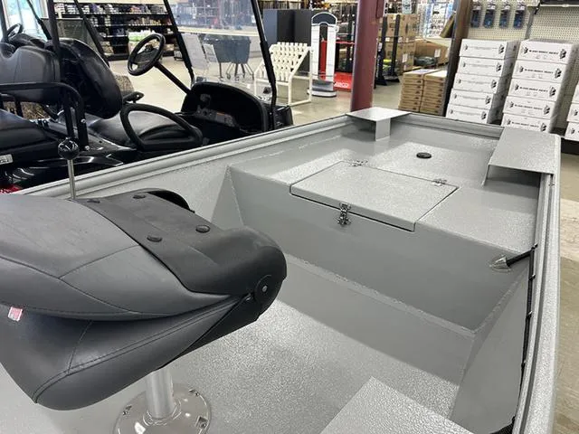 Slide: The Image of 2025 XTREME BOATS River Skiff 1542SS interior with seating and storage compartment. - 5