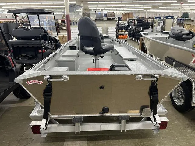 Slide: The Image of 2025 XTREME BOATS River Skiff 1542SS displayed indoors, showcasing its sleek design and seating. - 8