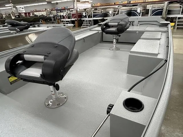 Slide: The Image of 2025 XTREME BOATS Brute 1754SS Tunnel interior with swivel seats in showroom. - 5
