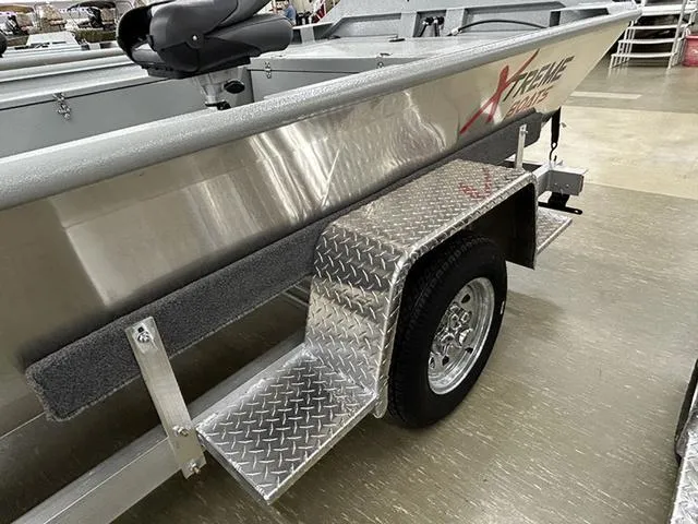Slide: The Image of 2025 XTREME BOATS Brute 1754SS Tunnel on trailer with diamond plate step. - 6