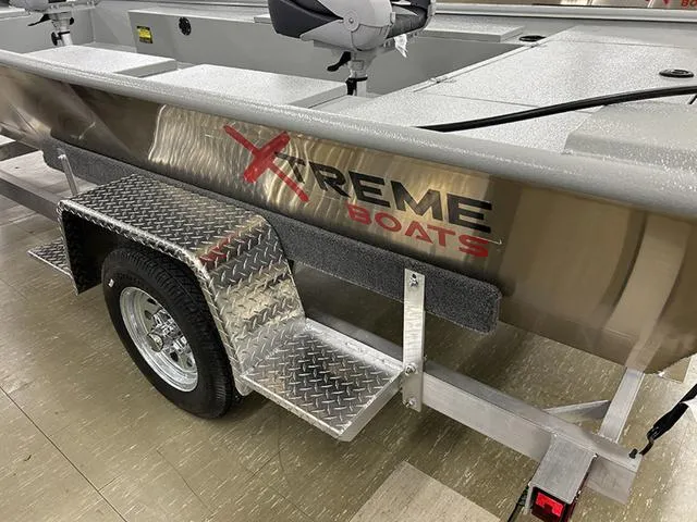 Slide: The Image of 2025 XTREME BOATS Classic 1854SS Tunnel on trailer, showcasing logo and design details. - 3