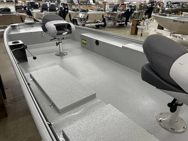 Slide: The Image of 2025 XTREME BOATS Classic 1854SS Tunnel, interior view with seating and storage. - 4