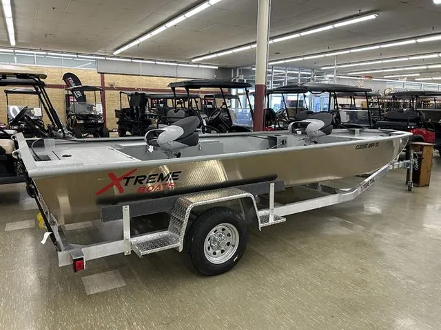 Slide: The Image of 2025 XTREME BOATS Classic 1854SS Tunnel displayed indoors on a trailer. - 6