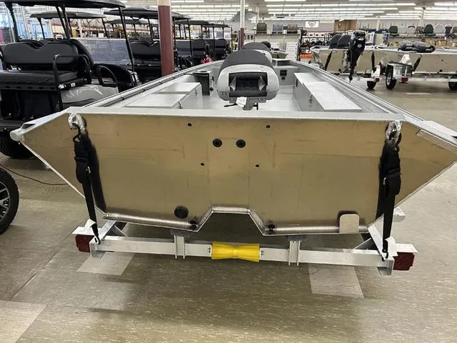 Slide: The Image of 2025 XTREME BOATS Classic 1854SS Tunnel displayed in showroom, rear view. - 7