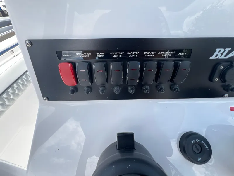 Slide: The Image of Control panel of 2025 Blackfin 222 CC boat with labeled switches and knobs. - 11
