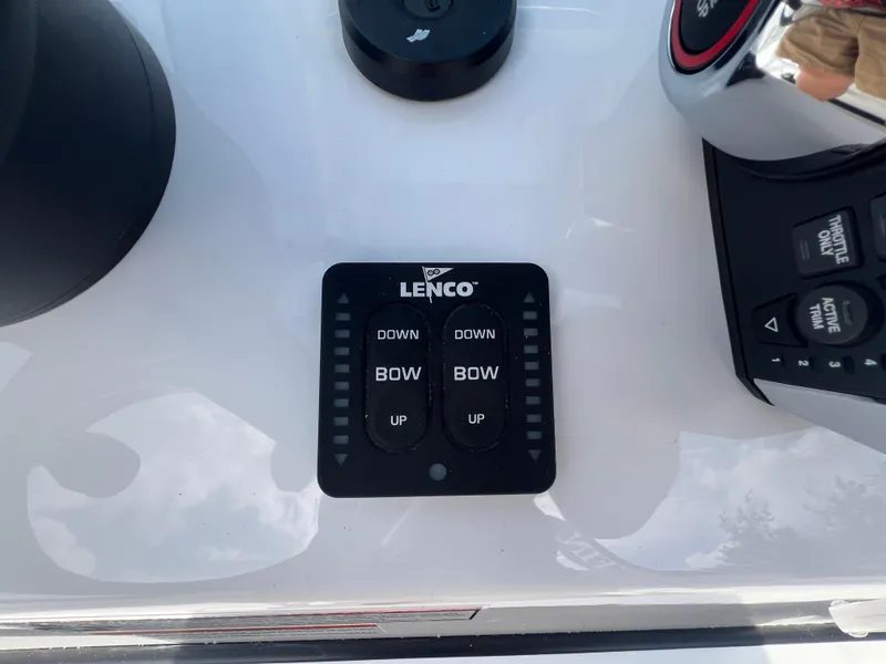 Slide: The Image of Control panel of a 2025 Blackfin 222 CC boat with Lenco trim tab switches. - 12