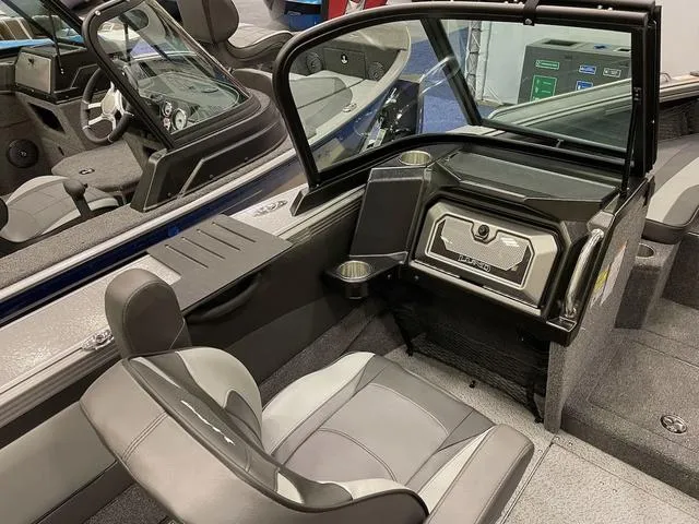 Slide: The Image of Interior of 2025 Lund 1975 Tyee Sport boat with modern seating and dashboard. - 5