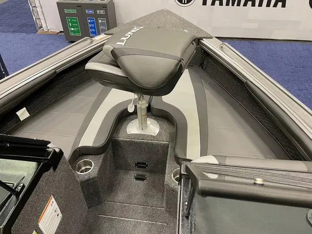 Slide: The Image of 2025 Lund 1975 Tyee Sport boat interior with seating and storage compartments. - 6