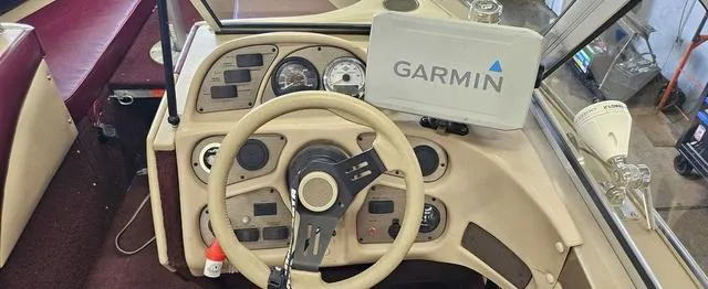 Slide: The Image of 1996 Lund 1950 Tyee boat dashboard with Garmin GPS and steering wheel. - 10