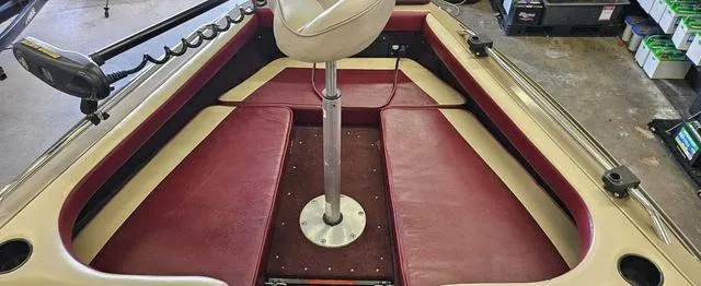 Slide: The Image of 1996 Lund 1950 Tyee boat interior with red and beige seating. - 11