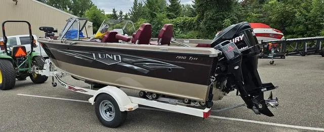 Slide: The Image of 1996 Lund 1950 Tyee boat on trailer with Mercury outboard motor. - 4