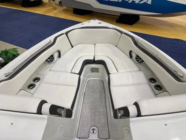 Slide: The Image of Luxurious seating area of 2023 Crownline 260 SS boat with white upholstery. - 4