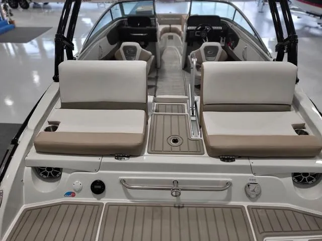 Slide: The Image of 2022 Crownline 240 SS SURF boat interior with seating and deck view. - 5