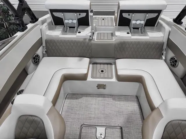 Slide: The Image of 2022 Crownline 240 SS SURF boat interior with luxurious seating and modern design. - 7