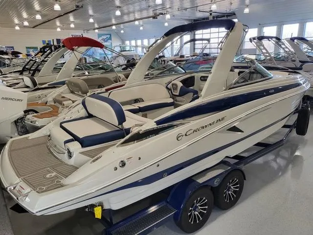 Slide: The Image of 2024 Crownline 280 SS boat in showroom, featuring sleek design and modern amenities. - 3