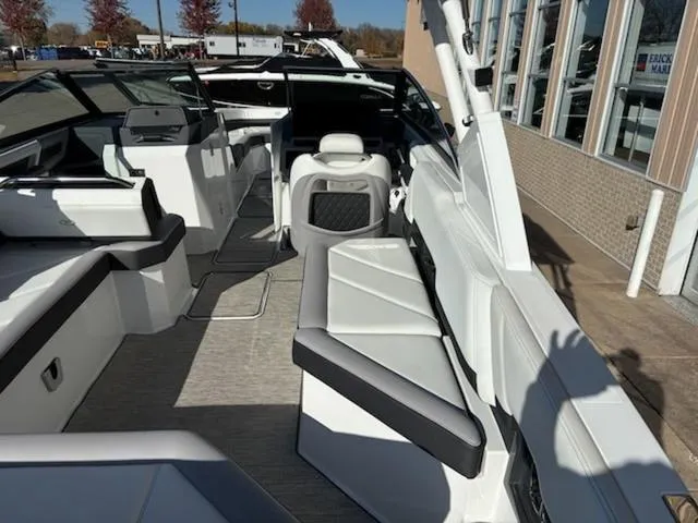 Slide: The Image of 2021 Cobalt R8 boat interior with sleek white seating and modern design. - 3