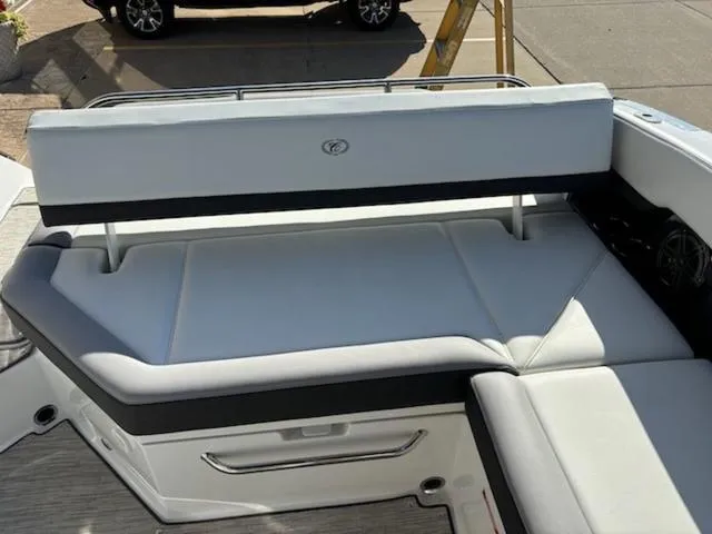 Slide: The Image of 2021 Cobalt R8 boat interior with white cushioned seating and sleek design. - 4