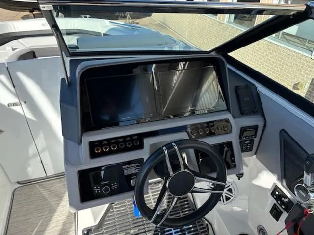 Slide: The Image of Cockpit of 2021 Cobalt R8 boat with modern steering and control panel. - 6