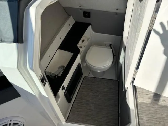 Slide: The Image of 2021 Cobalt R8 boat interior bathroom with sink and toilet. - 8