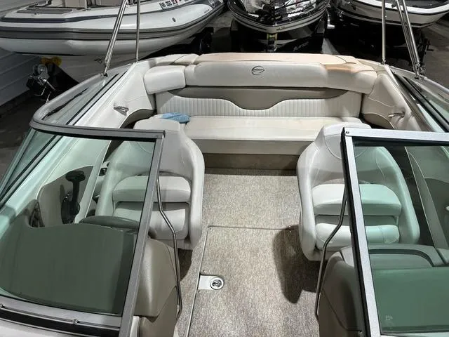 Slide: The Image of 2016 Crownline 21 SS boat interior with white seating and open cockpit design. - 11