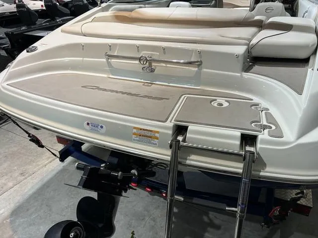 Slide: The Image of 2016 Crownline 21 SS boat with swim platform and ladder, showcasing sleek design. - 3