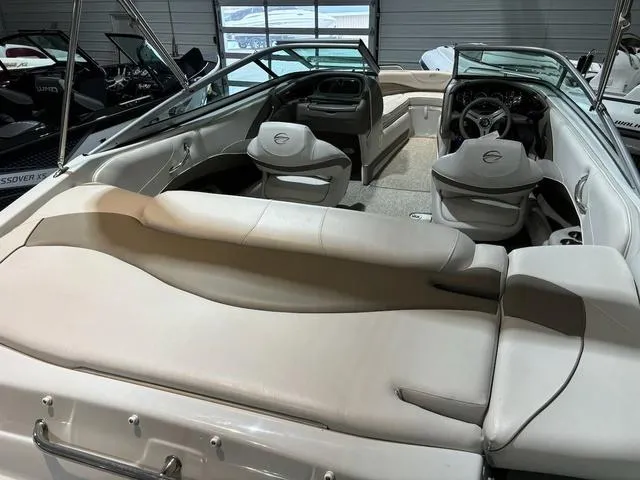 Slide: The Image of 2016 Crownline 21 SS boat interior with beige seating and steering wheel. - 4
