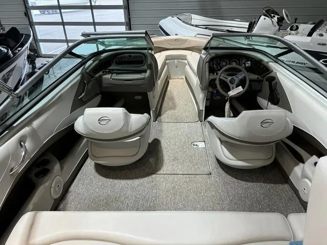 Slide: The Image of Interior of a 2016 Crownline 21 SS boat, featuring sleek seating and modern dashboard. - 6