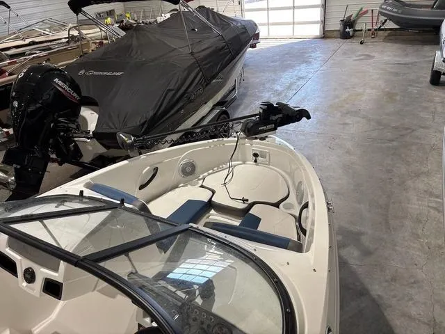 Slide: The Image of 2021 Tahoe 450 TF boat in storage, featuring a sleek design and modern equipment. - 10