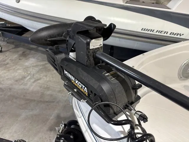 Slide: The Image of Minn Kota PowerDrive motor on a 2021 Tahoe 450 TF boat, docked near Walker Bay. - 12