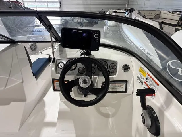 Slide: The Image of Steering console of a 2021 Tahoe 450 TF boat with navigation equipment. - 4