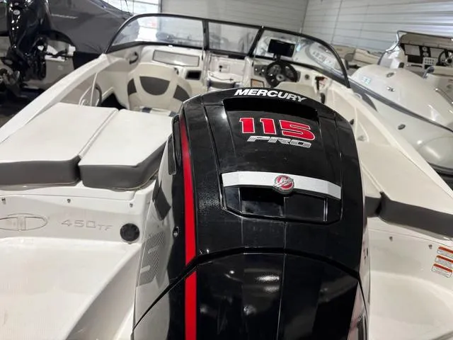 Slide: The Image of 2021 Tahoe 450 TF boat with Mercury 115 Pro outboard motor in showroom. - 8