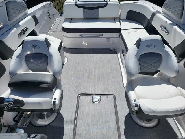 Slide: The Image of 2022 Chaparral 28 Surf boat interior with plush seating and modern design. - 12