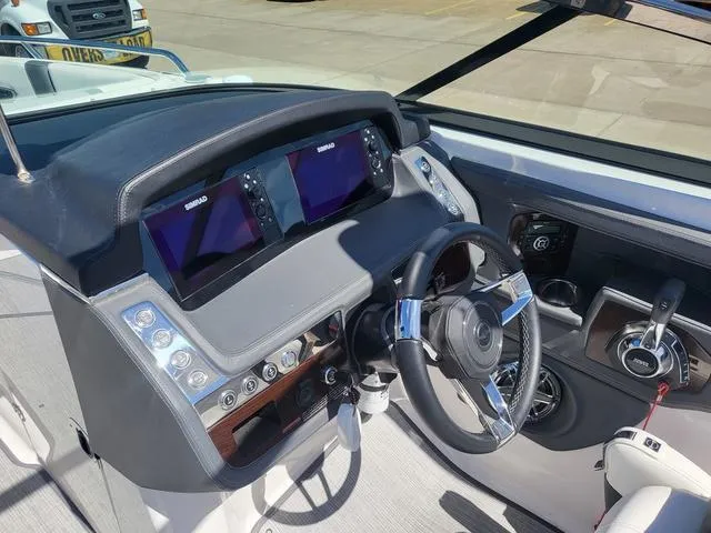 Slide: The Image of Cockpit of 2022 Chaparral 28 Surf boat with modern controls and dual displays. - 13