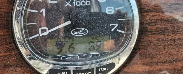 Slide: The Image of Close-up of a Sea Ray 270 Sundeck 2006 boat gauge displaying volts and hours. - 5