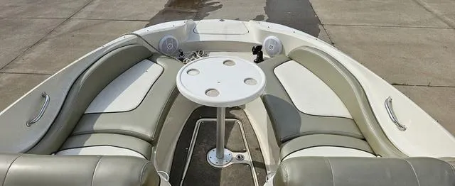 Slide: The Image of 2006 Sea Ray 270 Sundeck boat interior with seating and table. - 8