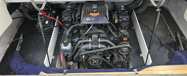 Slide: The Image of Engine compartment of a 1998 Cobalt 200BR boat, featuring a 5.7L V8 engine. - 10