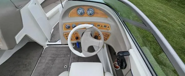 Slide: The Image of 1998 Cobalt 200BR boat dashboard with steering wheel and instrument panel. - 6