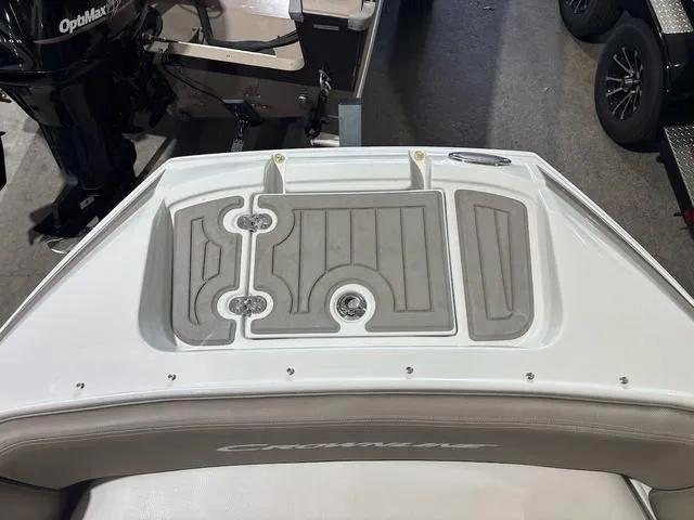Slide: The Image of 2019 Crownline E 215 XS boat deck with gray non-slip surface. - 11