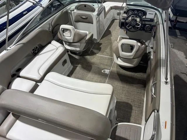 Slide: The Image of 2019 Crownline E 215 XS boat interior with seating and steering console. - 6