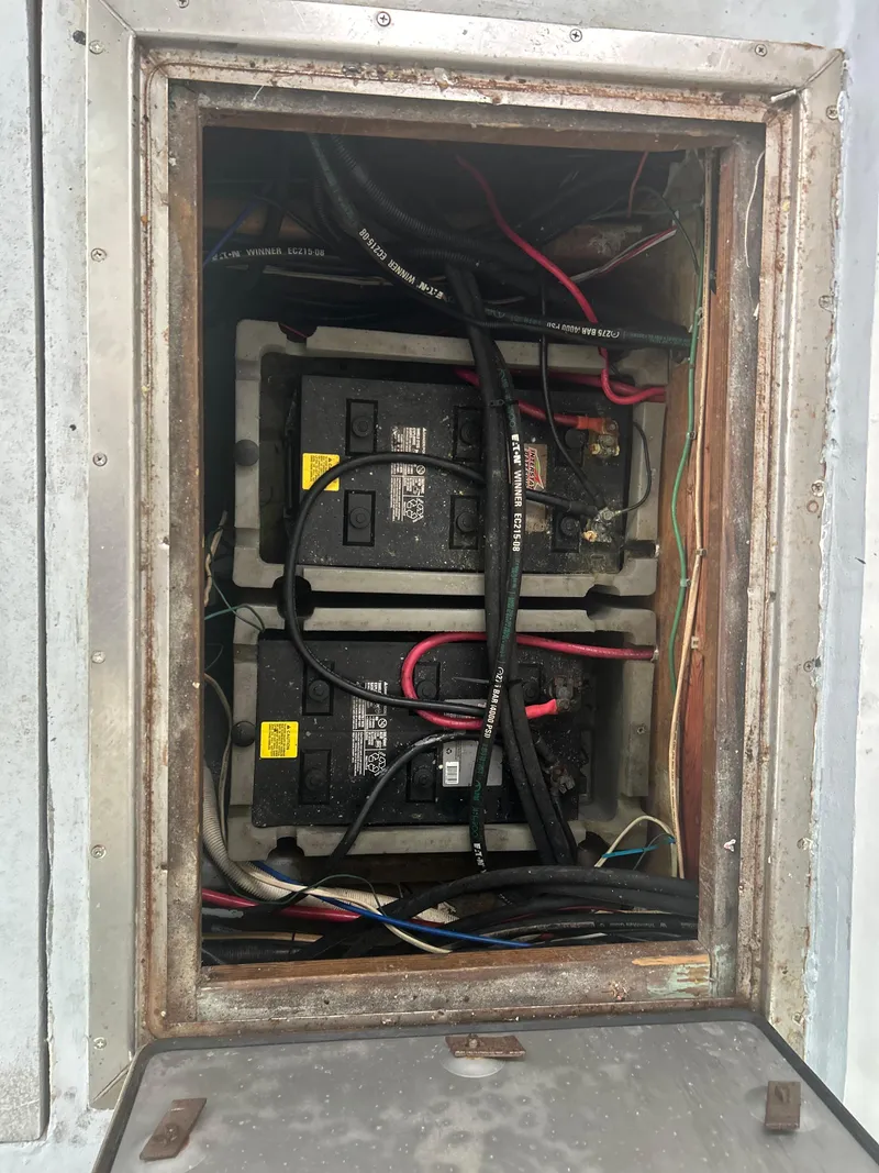 Slide: The Image of Battery compartment of a 1998 Northern Bay Pilothouse 36 with visible wiring. - 10
