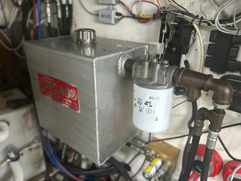 Slide: The Image of Engine compartment of a 1998 Northern Bay Pilothouse 36 with fuel filter and wiring. - 11