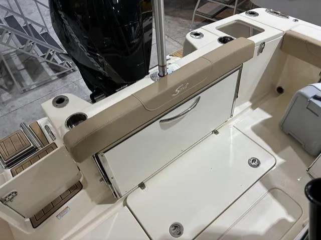 Slide: The Image of 2025 Scout 215 XSF boat interior with seating and storage compartments. - 5