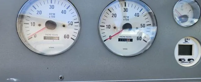 Slide: The Image of Dashboard of a 1998 Formula Boats 330 SS showing RPM and engine hours gauges. - 14