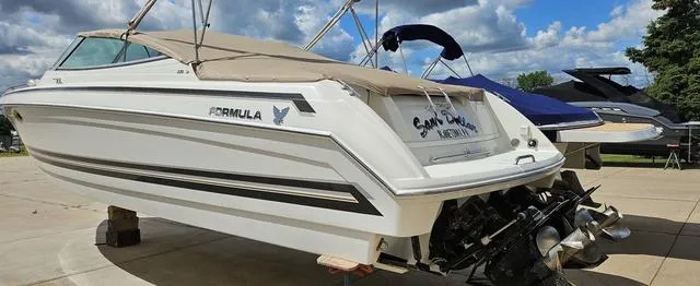 Slide: The Image of 1998 Formula Boats 330 SS on display, featuring sleek design and powerful engines. - 3