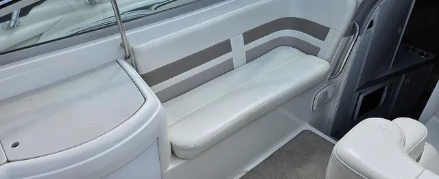 Slide: The Image of 1998 Formula Boats 330 SS interior with white seating and sleek design. - 7