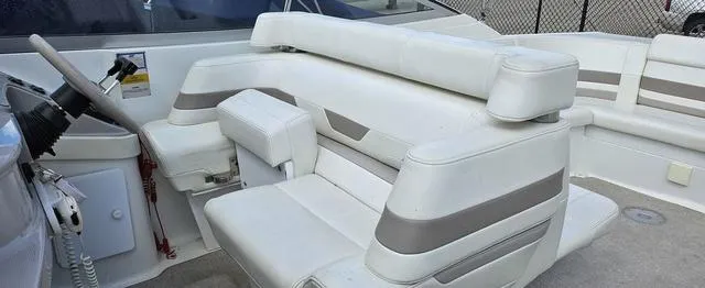 Slide: The Image of 1998 Formula Boats 330 SS interior with white and gray seating. - 9