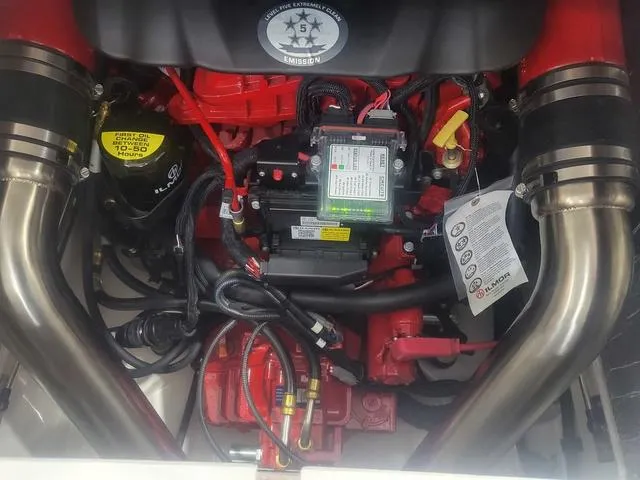 Slide: The Image of 2024 Thoroughbred u23i engine with red components and visible wiring. - 12